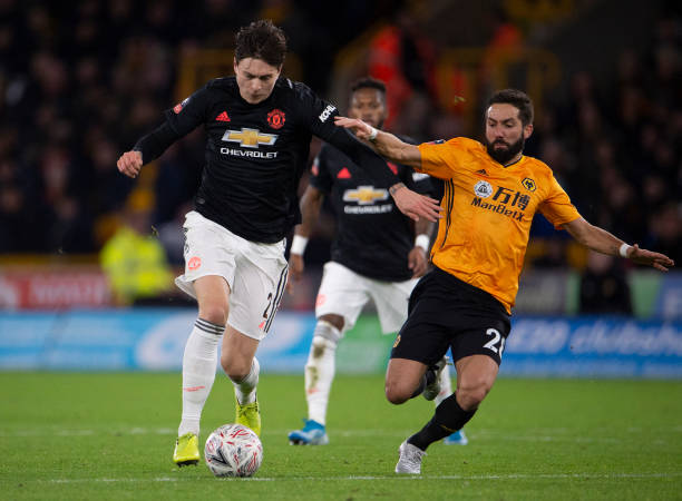 WOLVERHAMPTON, ENGLAND - JANUARY 04: Victor Lindelöf of Manchester United and João Moutinho of Wolverhampton Wanderers during the FA Cup Third Round match between Wolverhampton Wanderers and Manchester United at Molineux on January 04, 2020 in Wolverhampton, England. (Photo by Visionhaus)