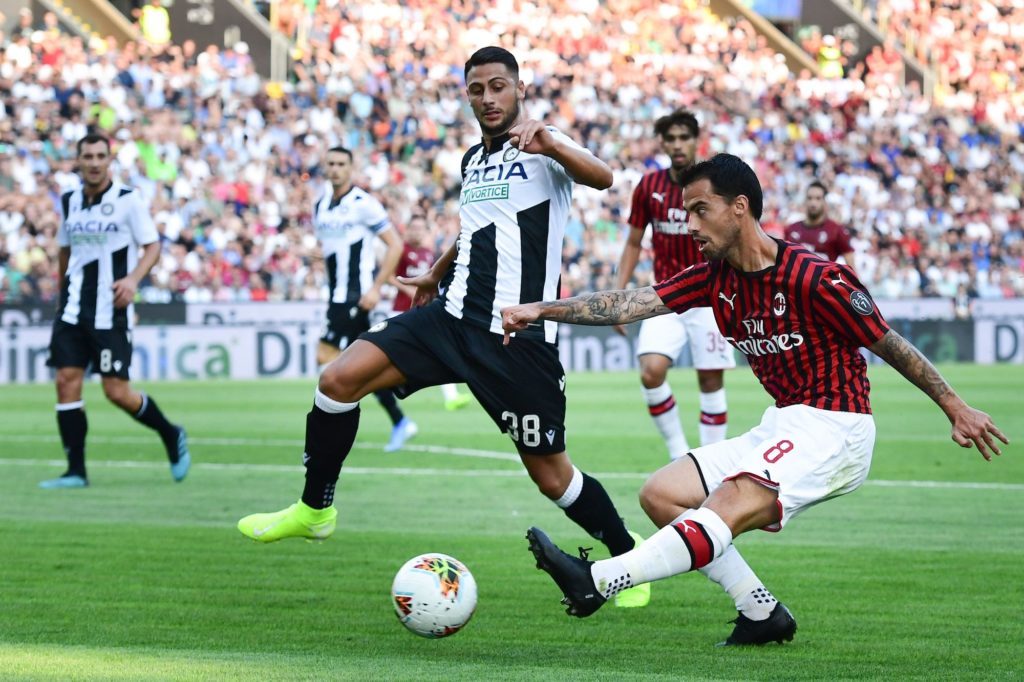 AC Milan’s Spanish forward Suso (R) centres past Udinese’s Italian midfielder Rolando Mandragora during the Italian Serie A football match Udinese vs AC Milan on August 25, 2019 at the Friuli stadium in Udine. (Photo by Miguel MEDINA / AFP) (Photo credit should read MIGUEL MEDINA/AFP/Getty Images)